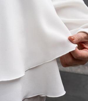 ドッキングイレヘムブラウス