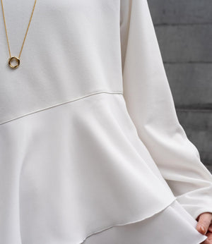 ドッキングイレヘムブラウス