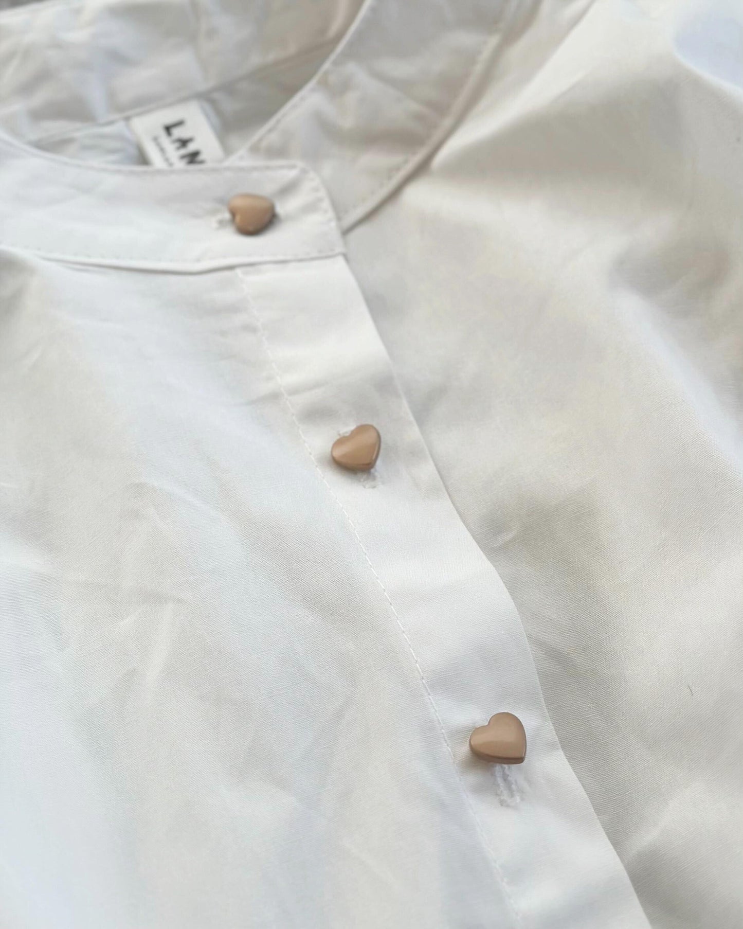 ハートボタンシャツ