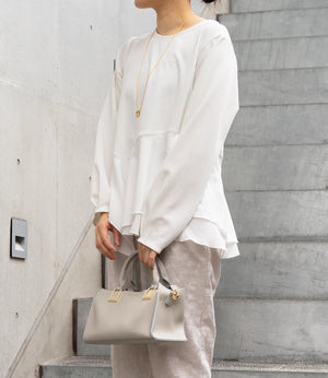 ドッキングイレヘムブラウス