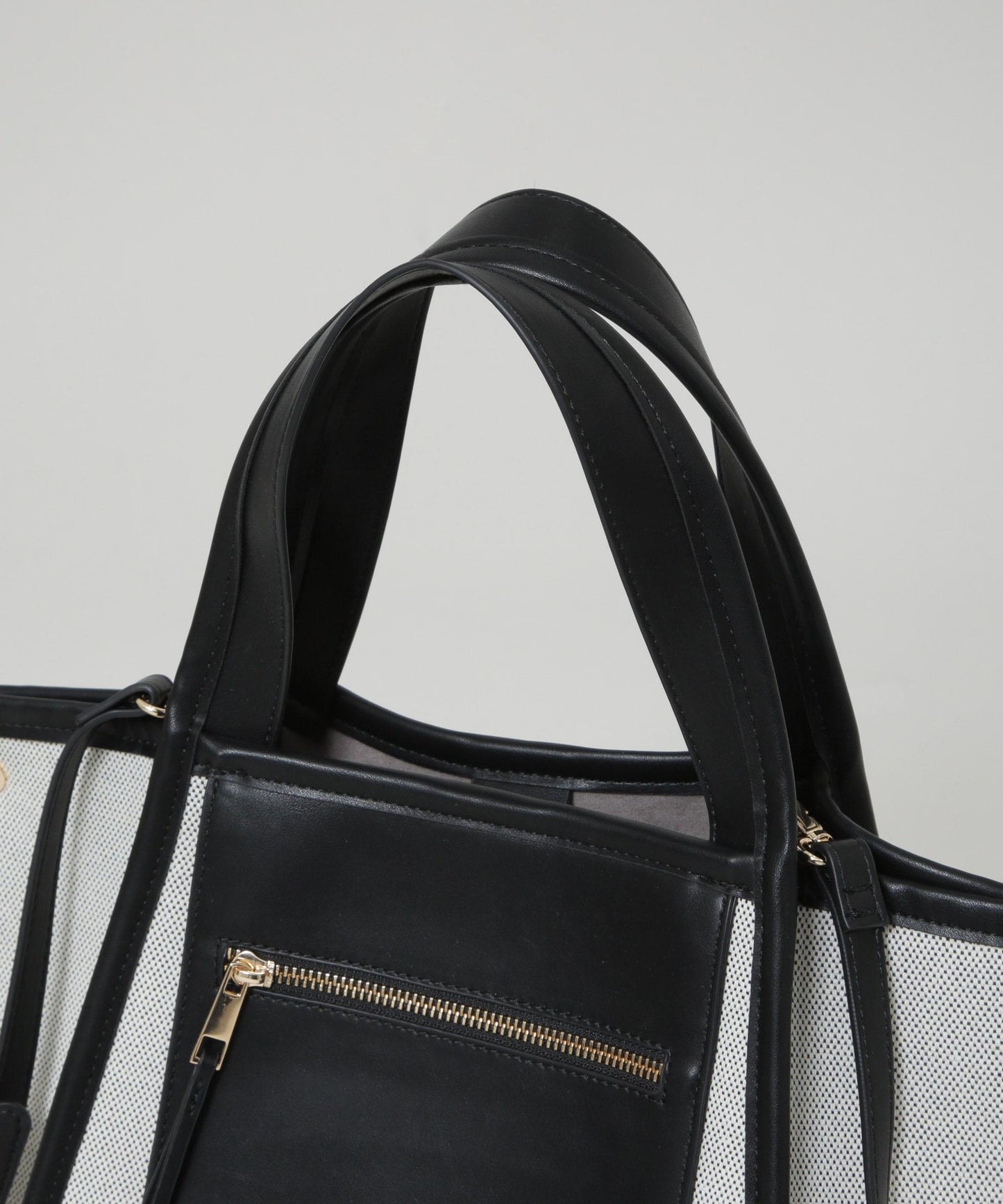 キャンバス×フェイクレザーポケットバッグ