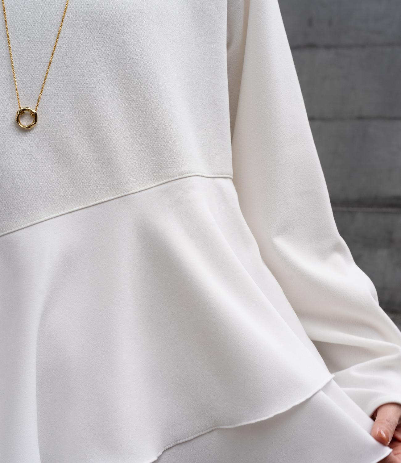 ドッキングイレヘムブラウス